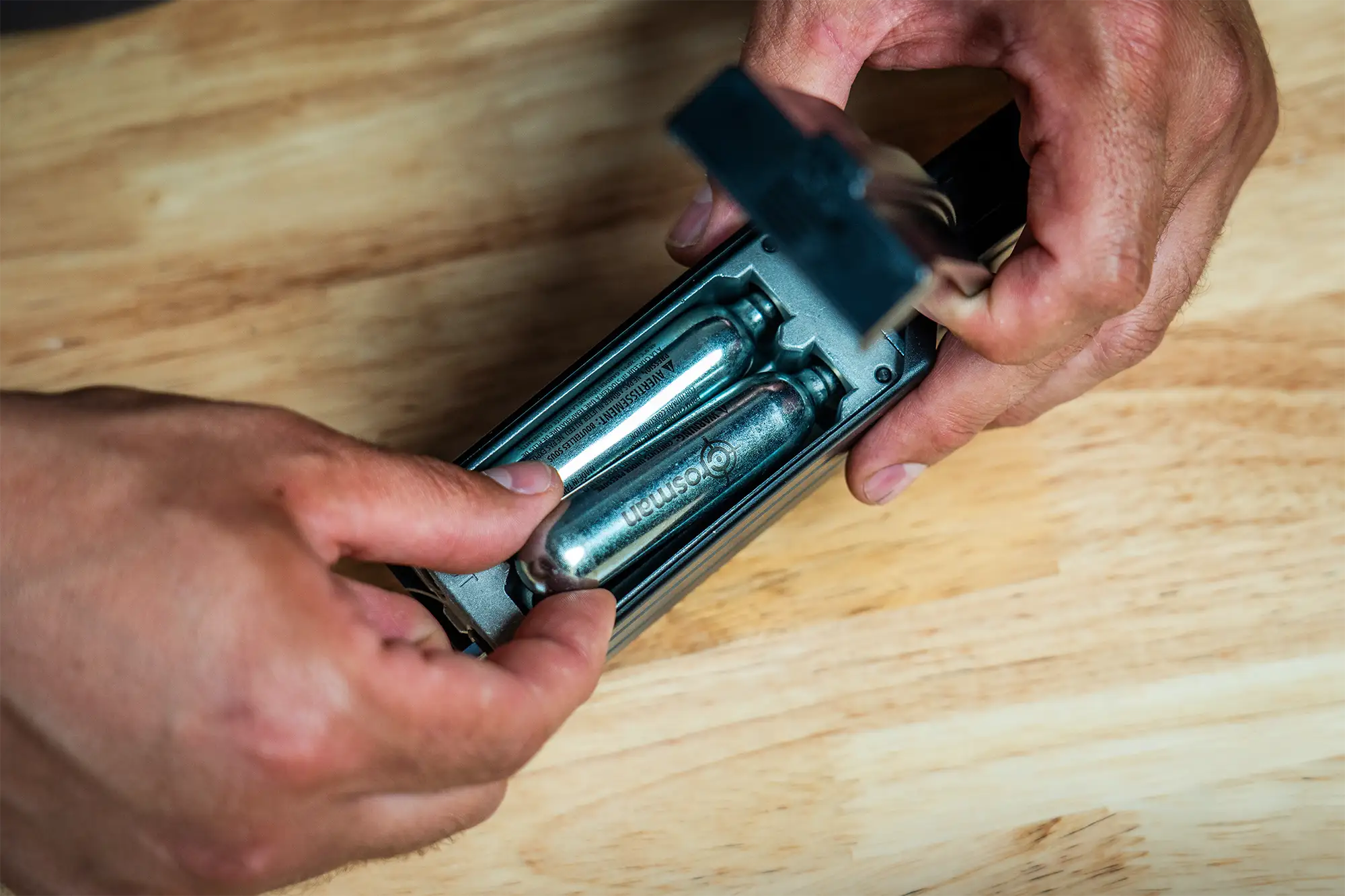 Crosman Full Auto High Capacity QR-Mag (BB) CFAHCM Indoor Lifestyle Being Loaded with C02 on Workbench