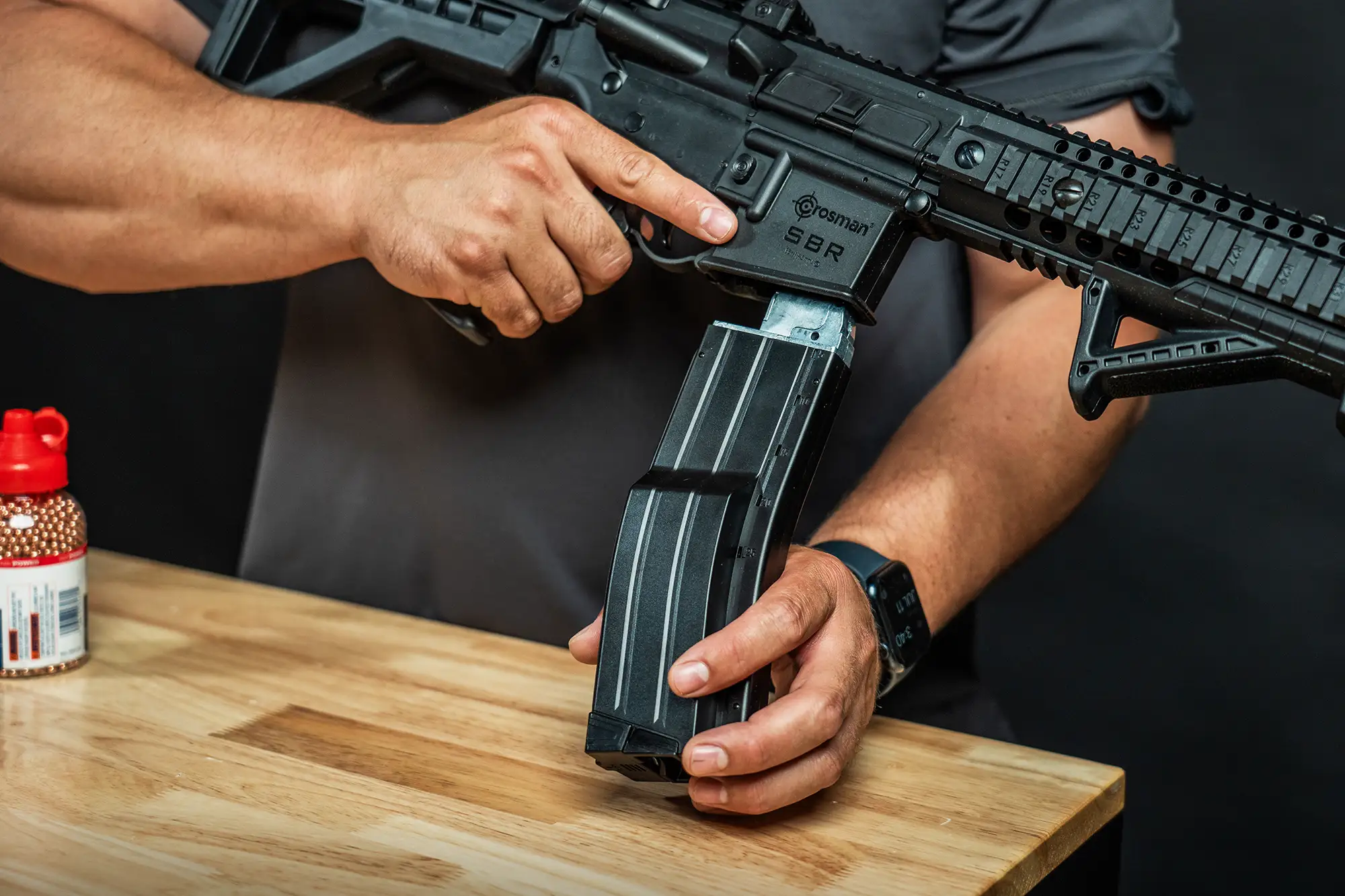 Crosman Full Auto High Capacity QR-Mag (BB) CFAHCM Indoor Lifestyle Being Loaded into Full Auto BB Rifle