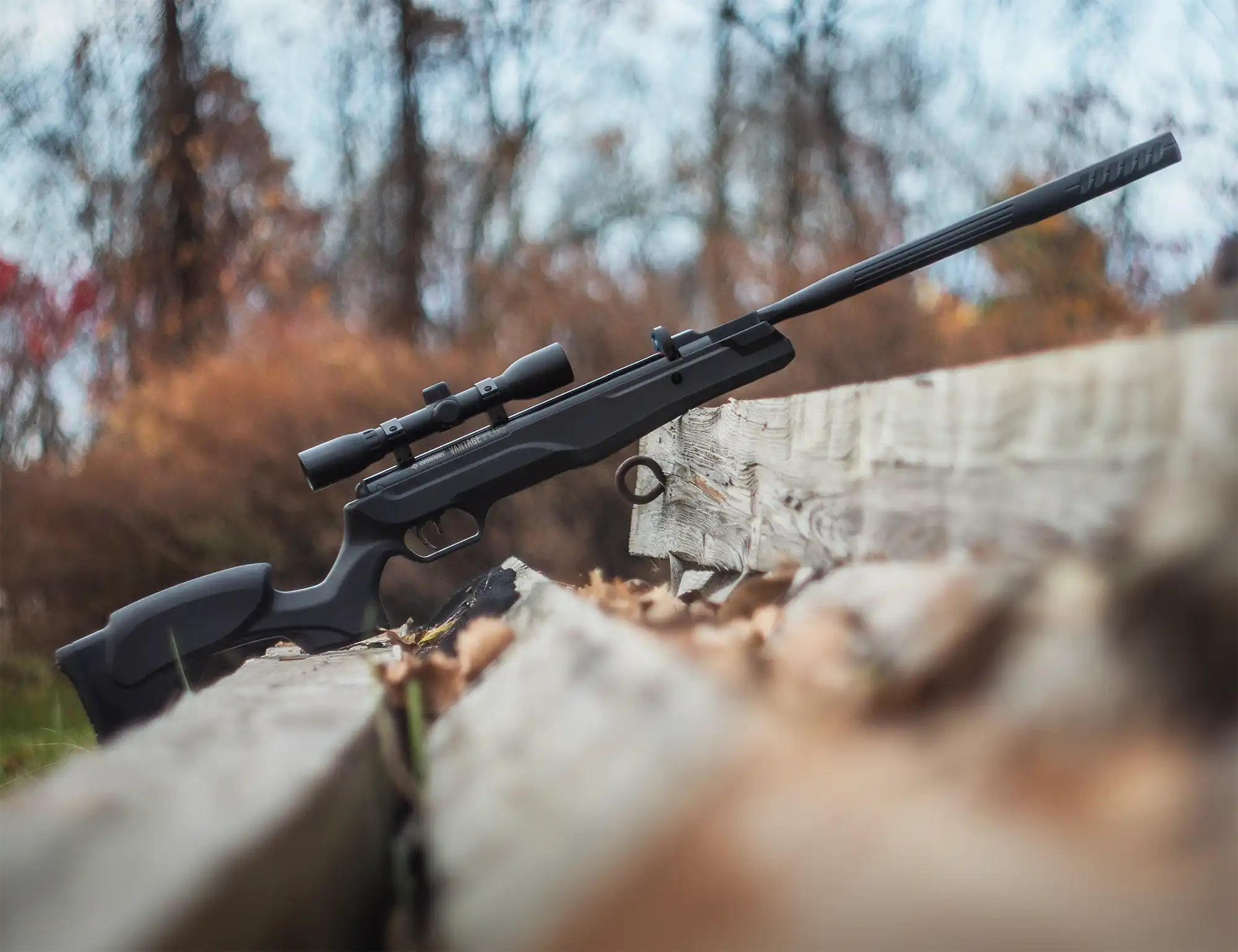 Crosman Vantage Plus Break Barrel in .22 Cal CVANP2X Outdoor Lifetsyle Sitting on Old Wood