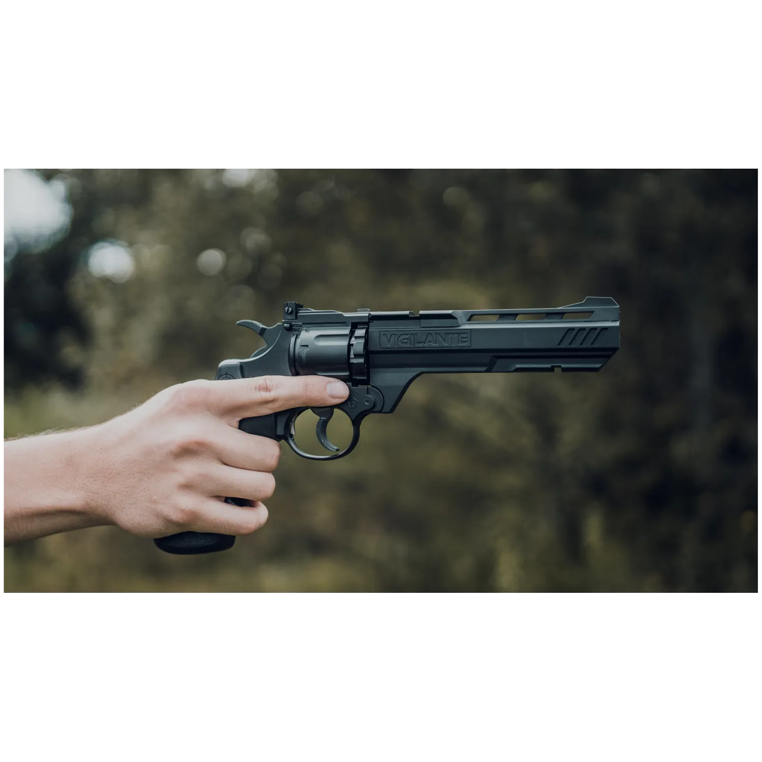 Crosman Vigilante CO2 Revolver Air Pistol with user holding and pointing the pistol lifestyle picture