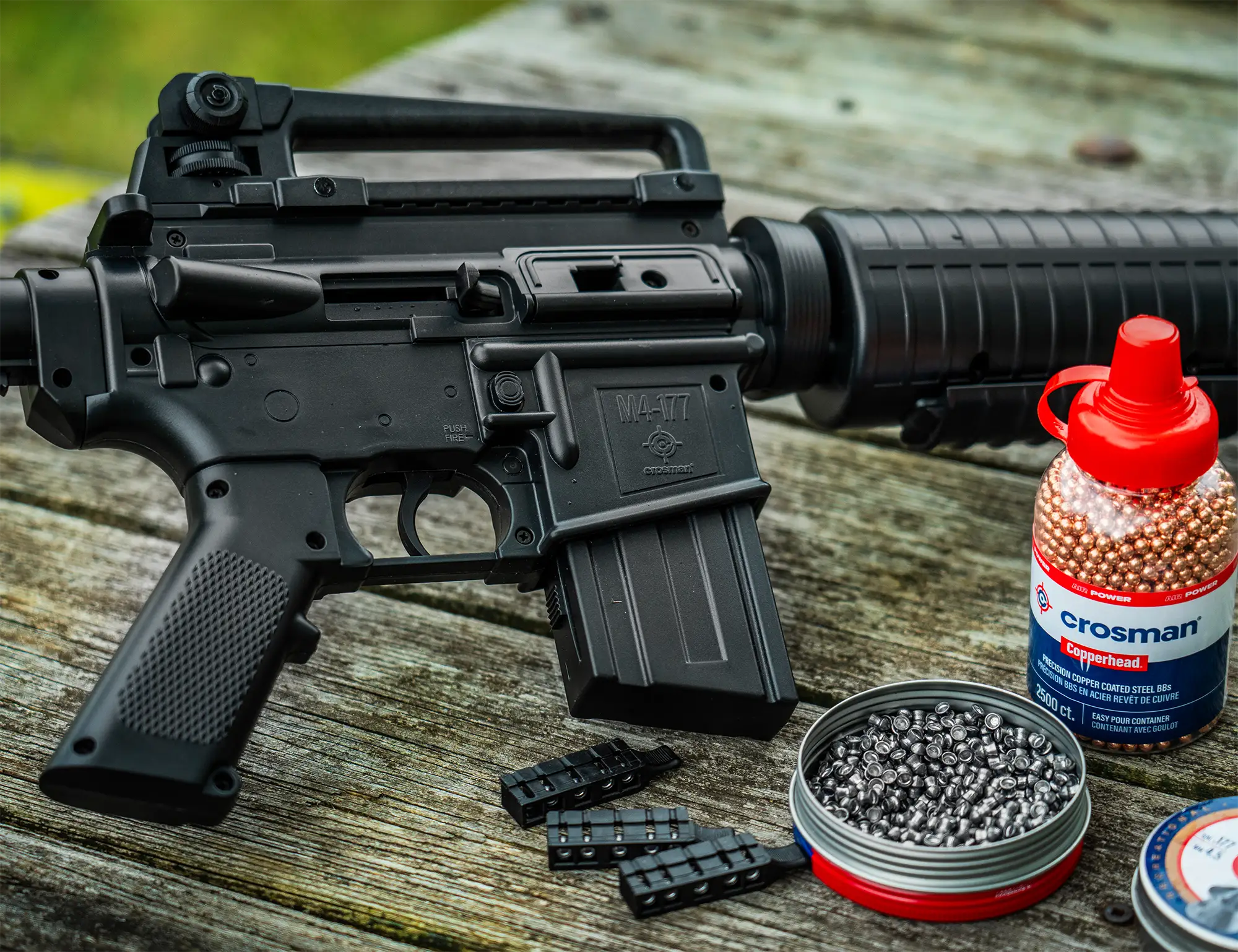 Crosman M4-177 .177 Pellet / BB Pneumatic Pump Air Rifle M4-177KT-N Outdoor Lifestyle Sitting on a Bench