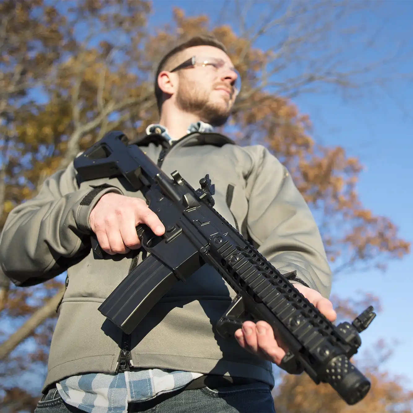 DPMS SBR Full Auto BB Air Rifle Outdoor Lifestyle Man Holding Idle